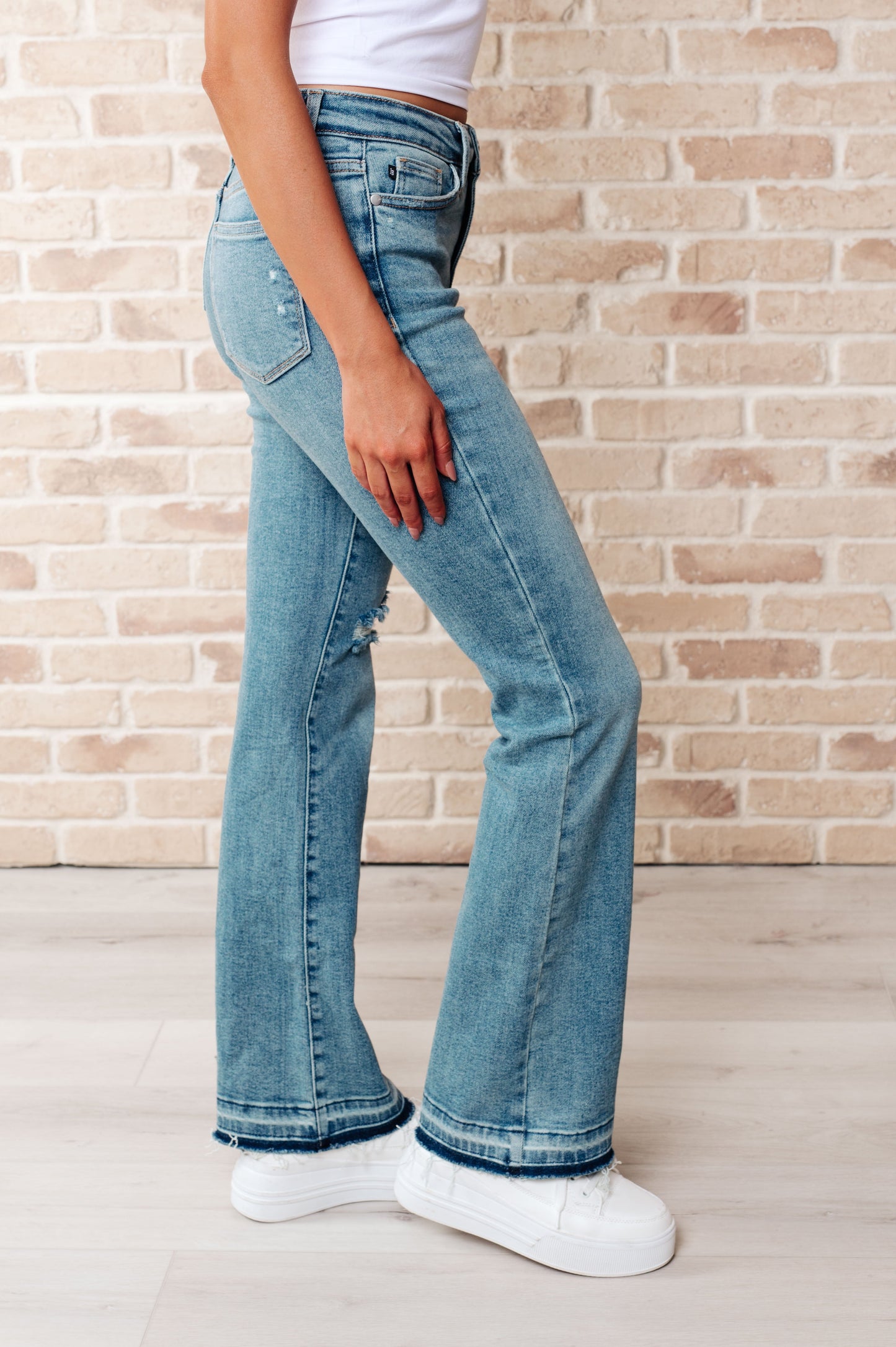 JUDY BLUE Mid Rise Distressed Released Hem Bootcut Jeans